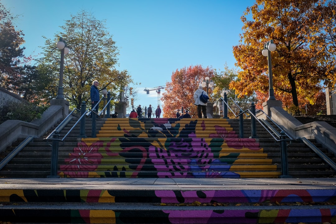 a group of people standing on top of a set of stairs