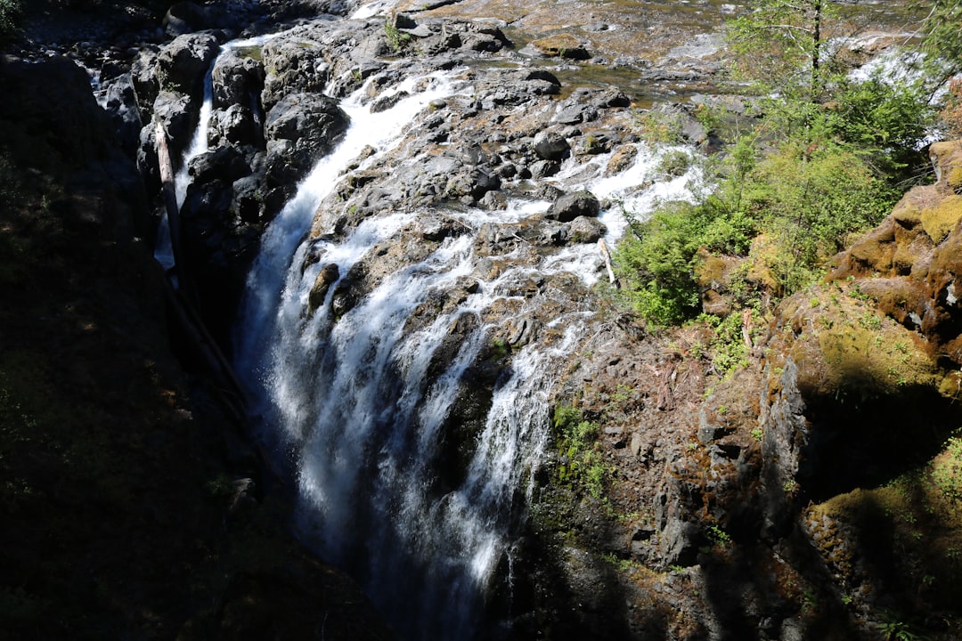 A large waterfall with lots of water coming out of it